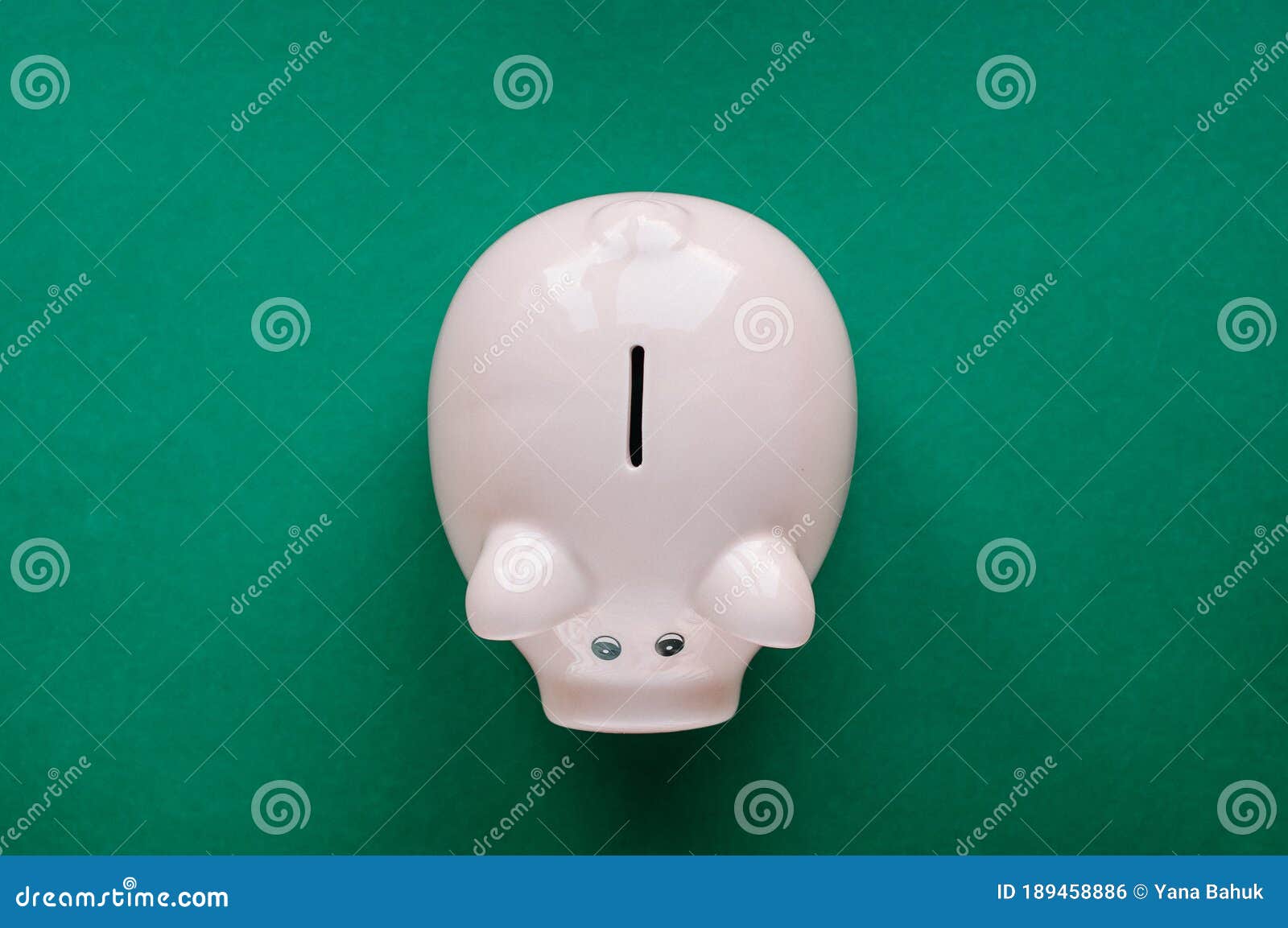 a piggy bank saving and investment theme on a green paper background,