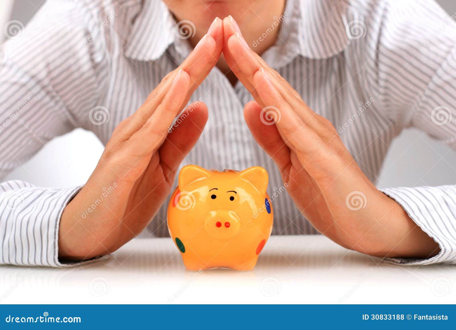 piggybank and hands.