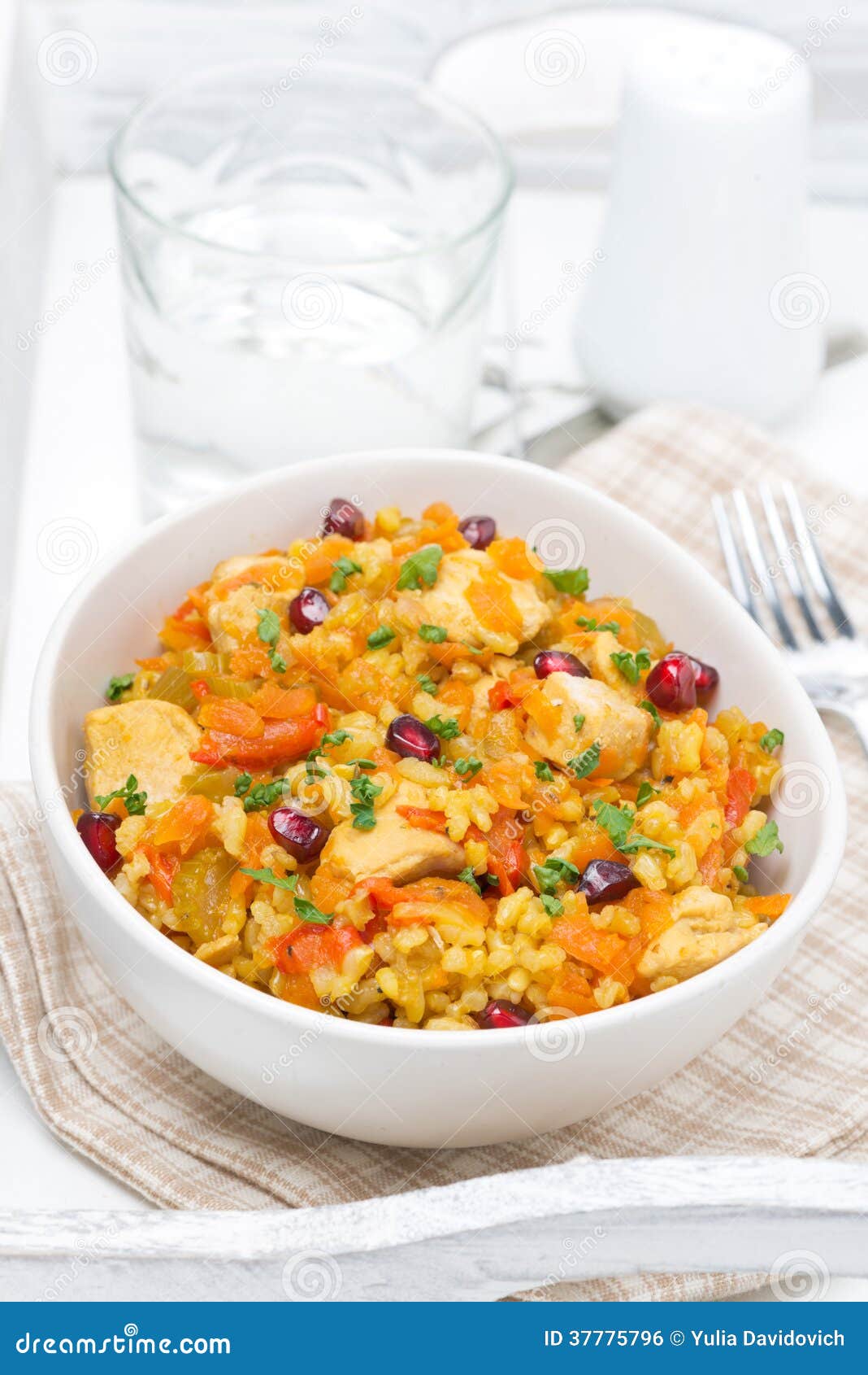Pilaf with Vegetables, Chicken and Pomegranate in a Bowl Stock Photo