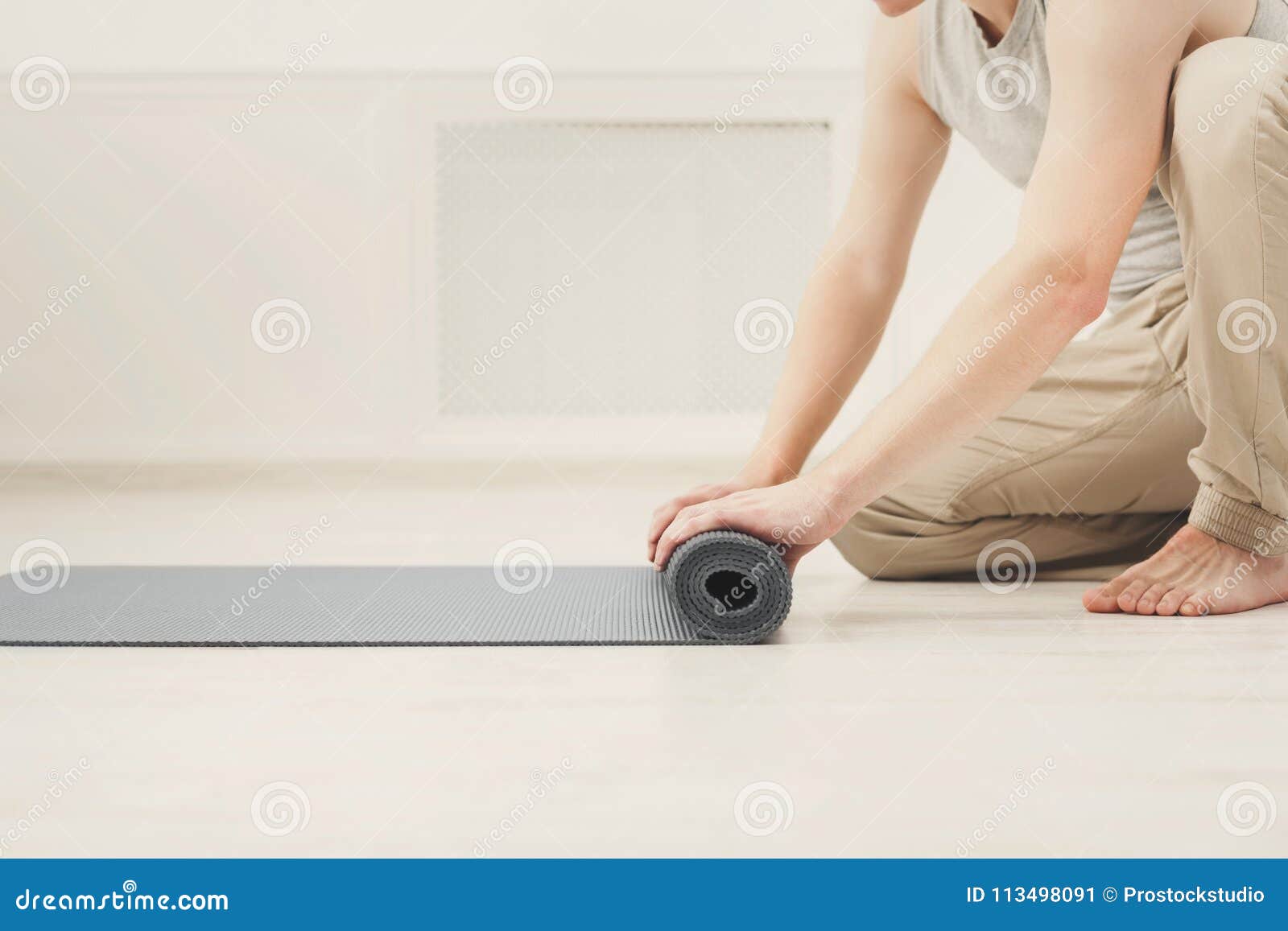 Rolling Up Fitness Mat For Exercise Copy Space Stock Image Image