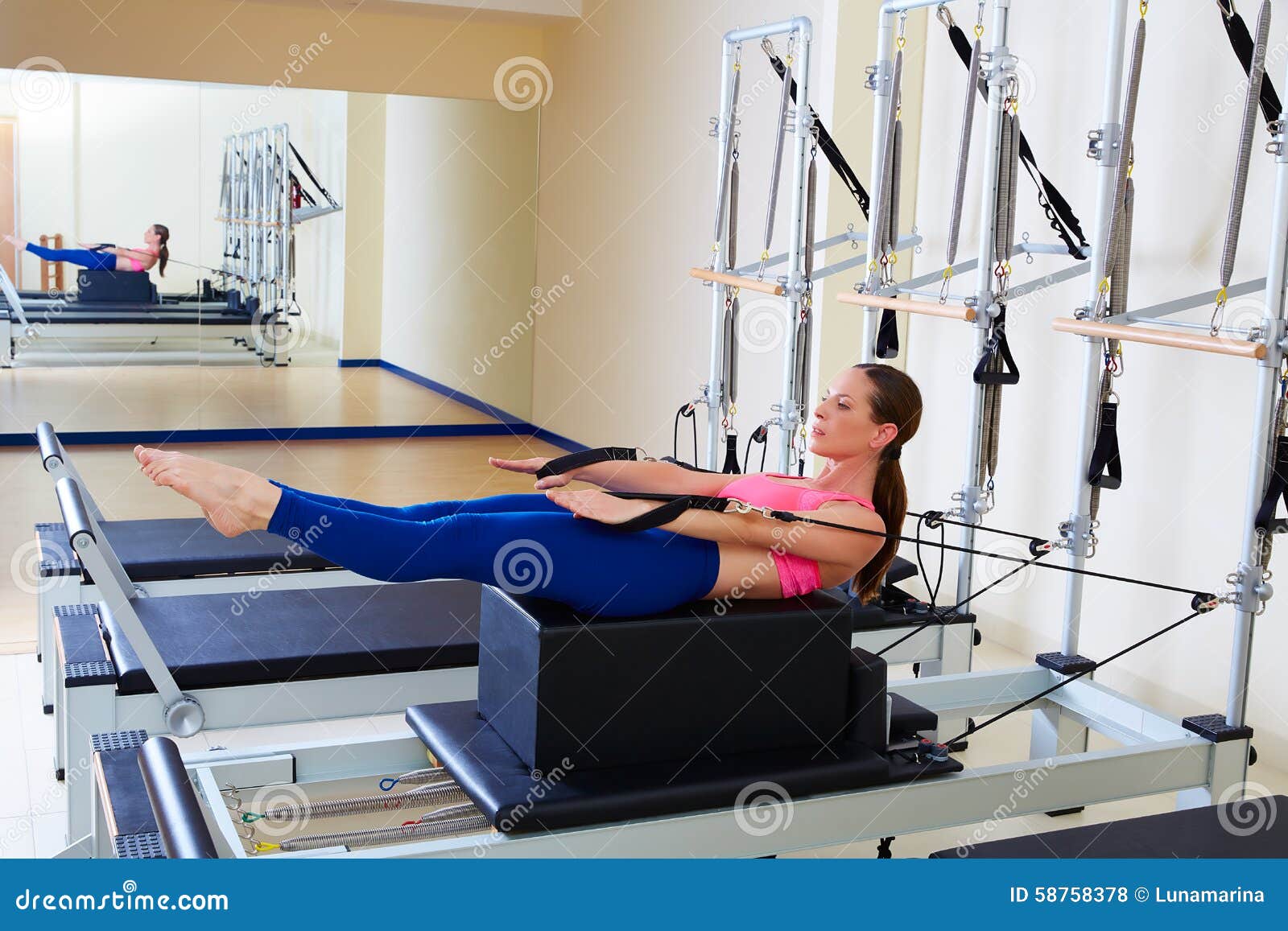 pilates reformer woman back stroke exercise