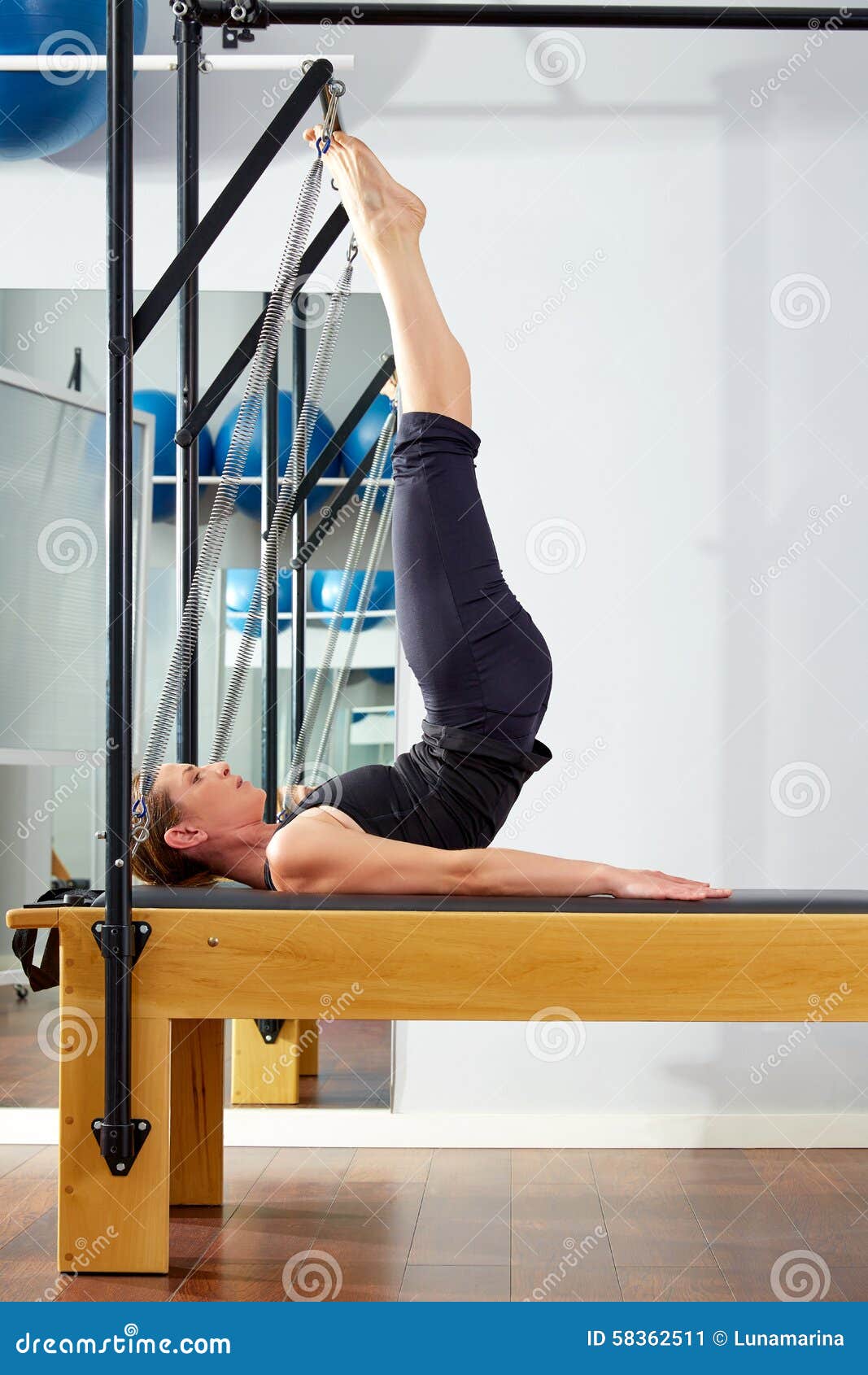 Pilates Woman in Reformer Tower Exercise at Gym Stock Image