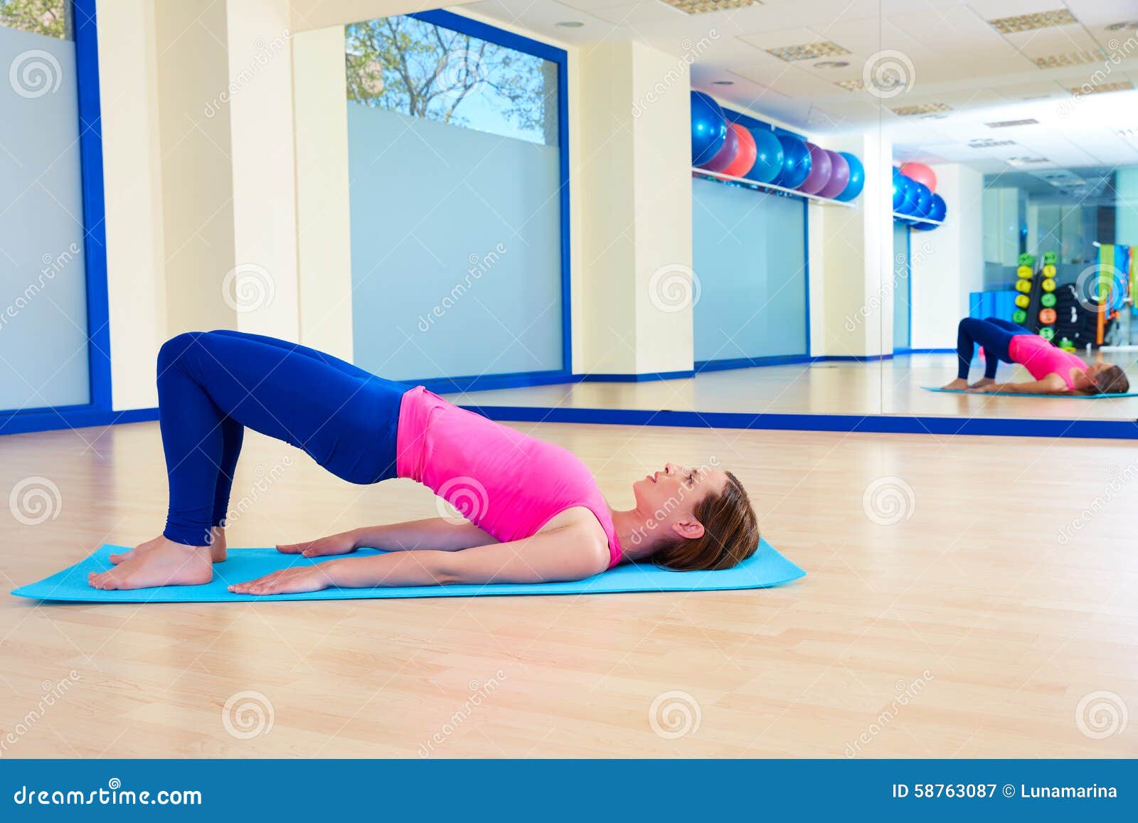 pilates woman shoulder bridge exercise workout
