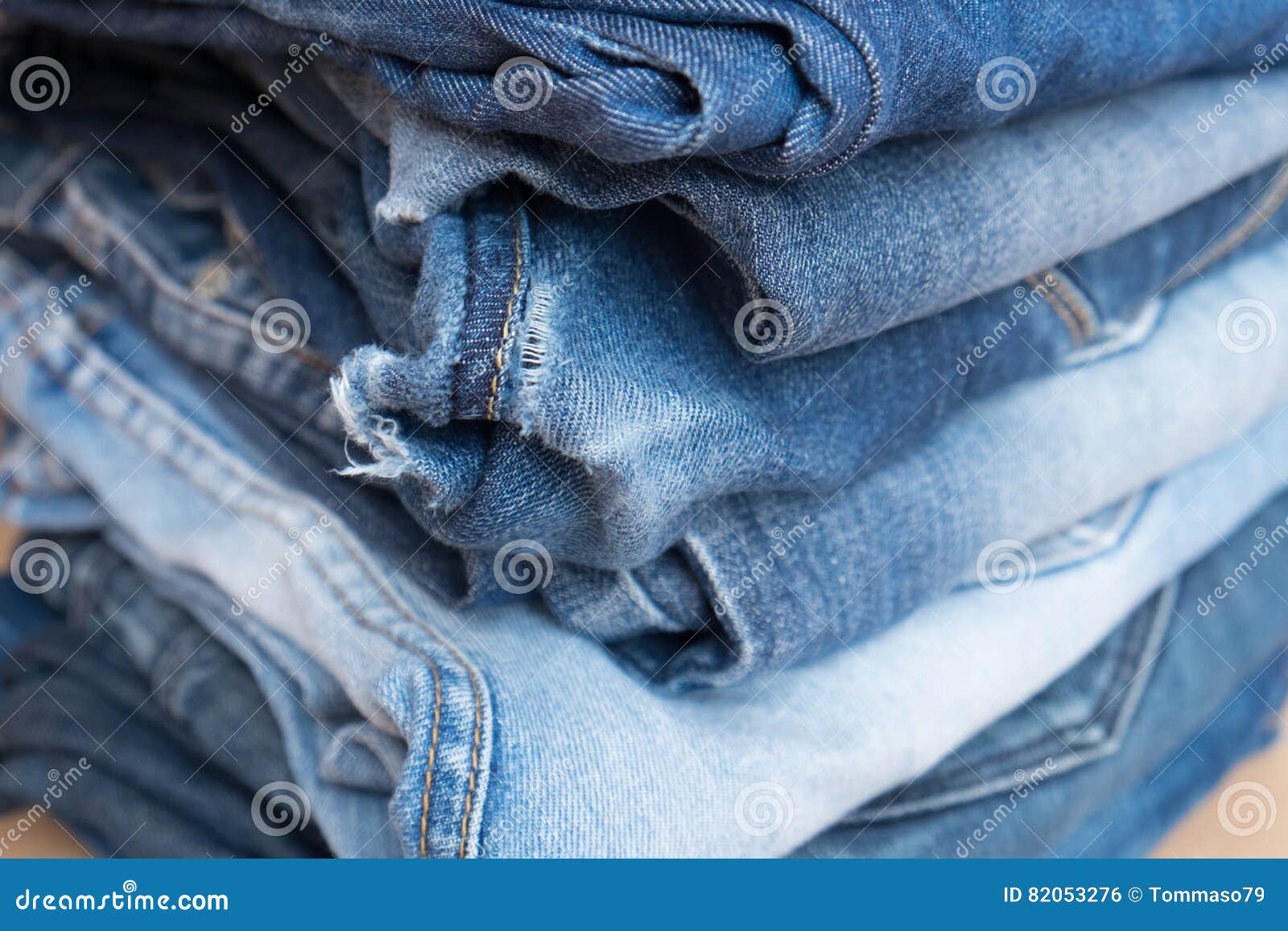 Pile of Blue Jeans Trousers Stock Photo - Image of discount, buttons ...