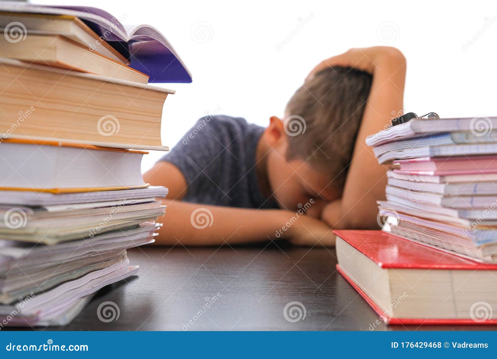 Pile of Books for School Homework and Tired Disappointed Schoolboy