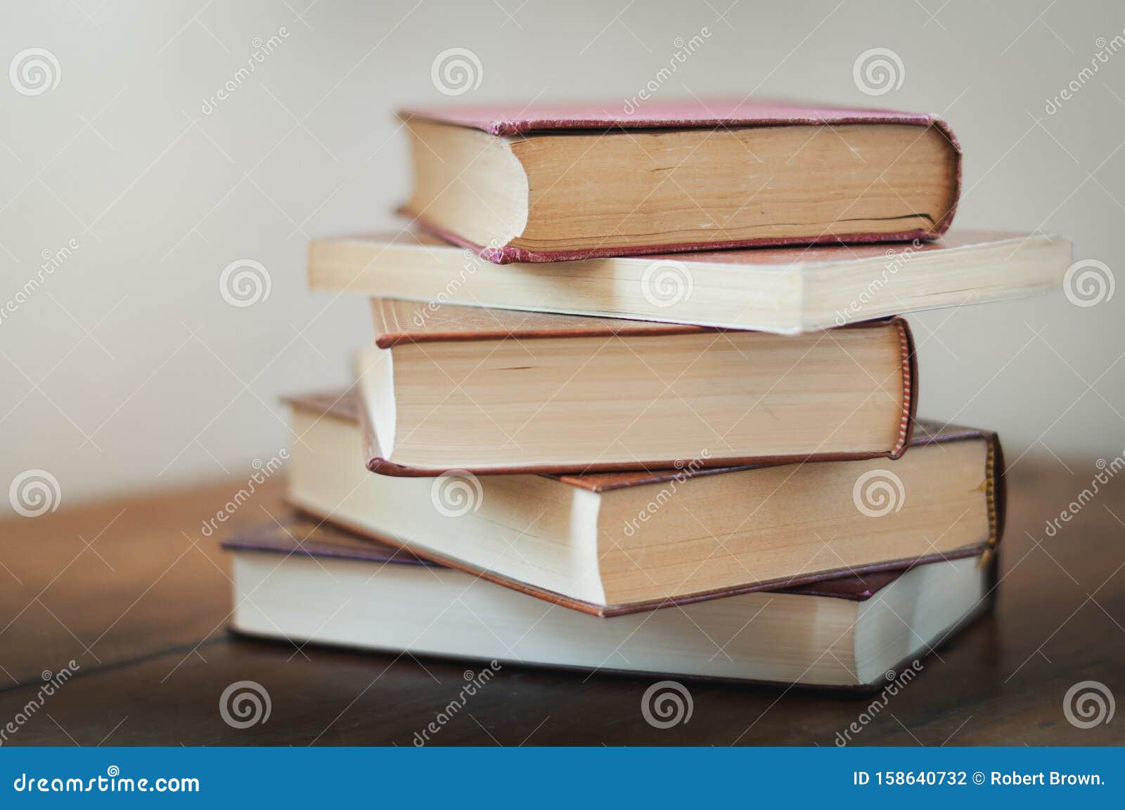 A pile of books on a table stock photo. Image of books - 158640732