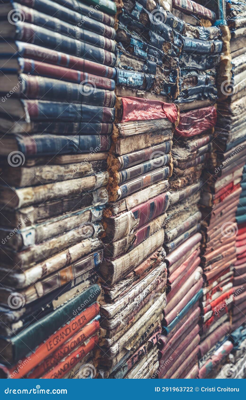 pile of books volumes inside the bookstore libreria acqua alta in venice