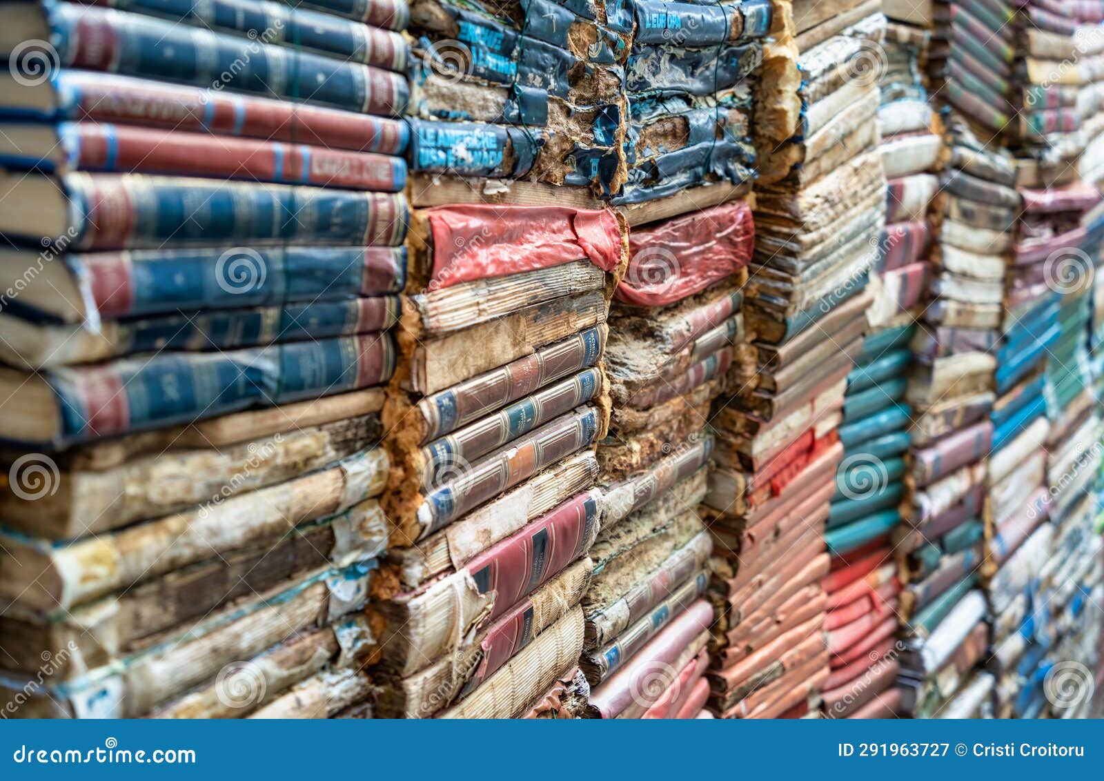 pile of books volumes inside the bookstore libreria acqua alta in venice