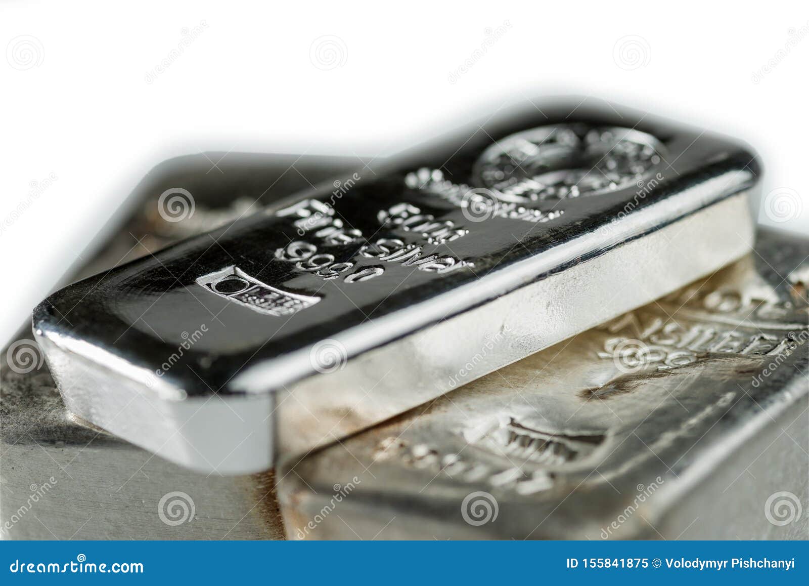 pile cast silver bullion on a white background.