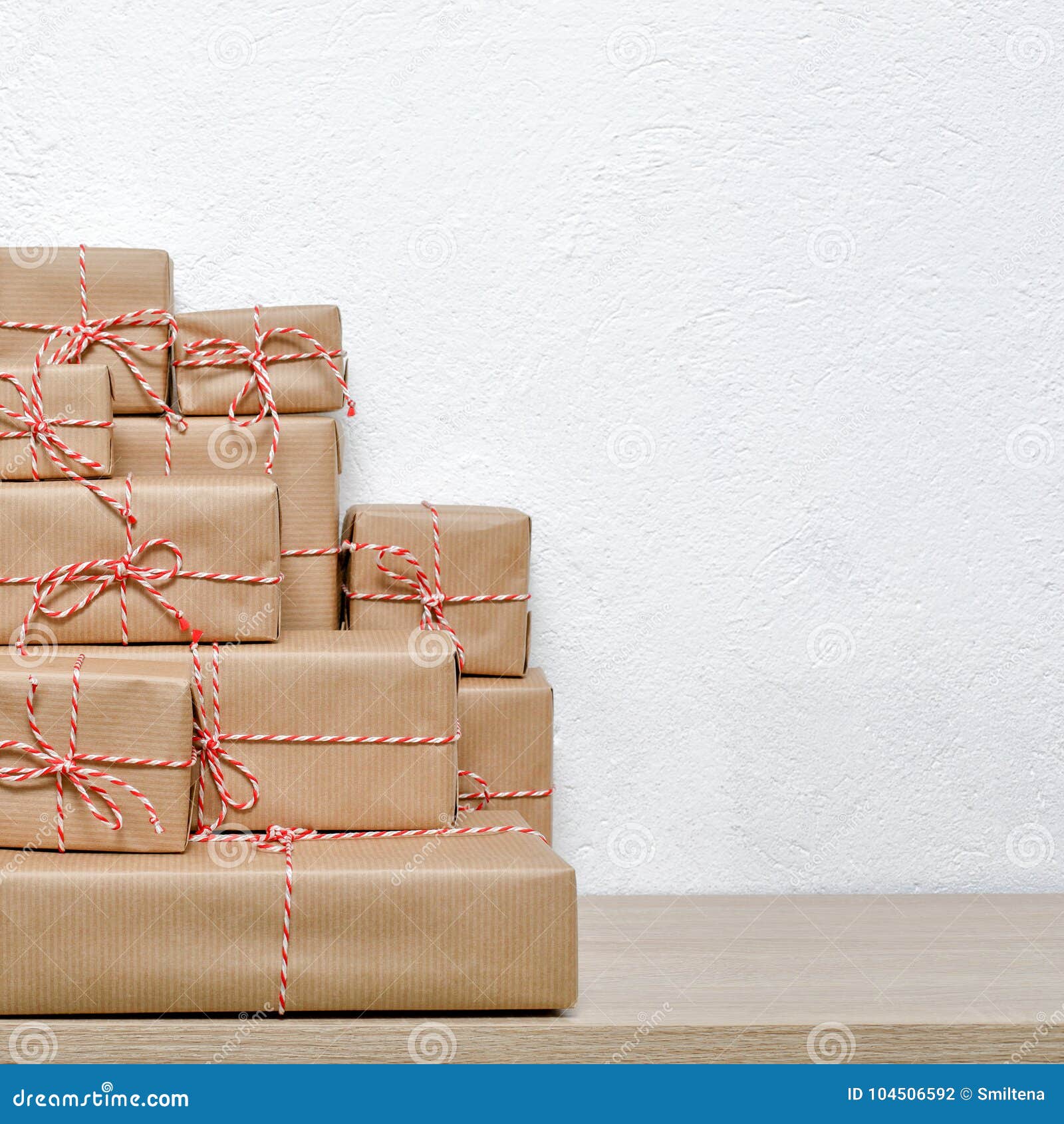 A Pile of Christmas Gifts Wrapped in Rustic Paper Stock Photo - Image ...