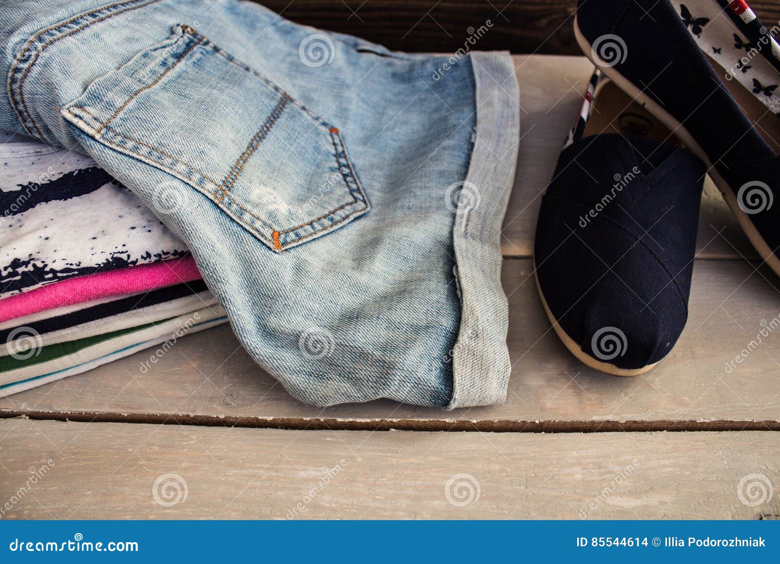 Pile of the Clothing on a Table Shoes Stock Photo - Image of fashion ...