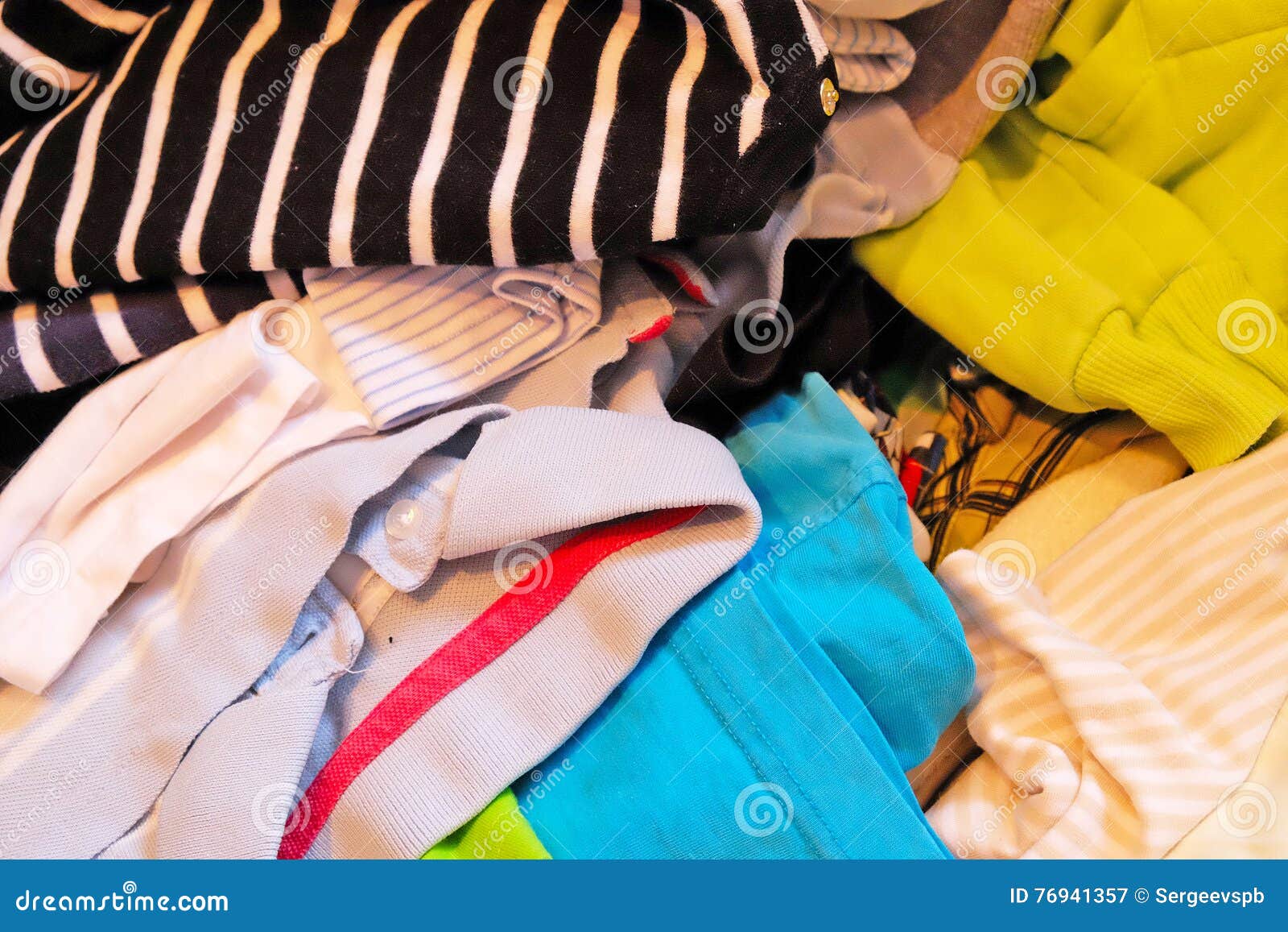 Pile of colored clothes stock image. Image of jacket - 76941357