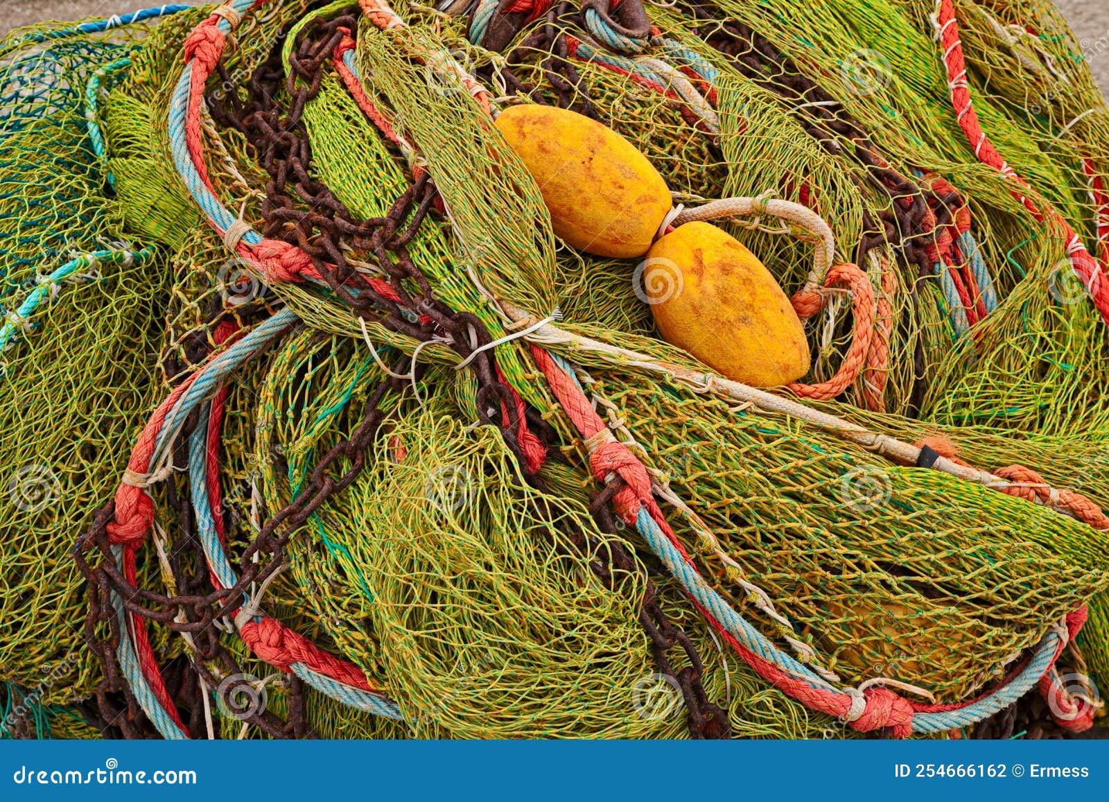 Pile of Colorful Fishing Net, Rope and Floats on the Fishermen`s