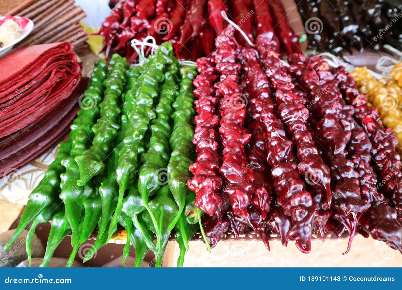 pile of colorful georgian traditional sweets called churchkhela for sale in the sweets shop