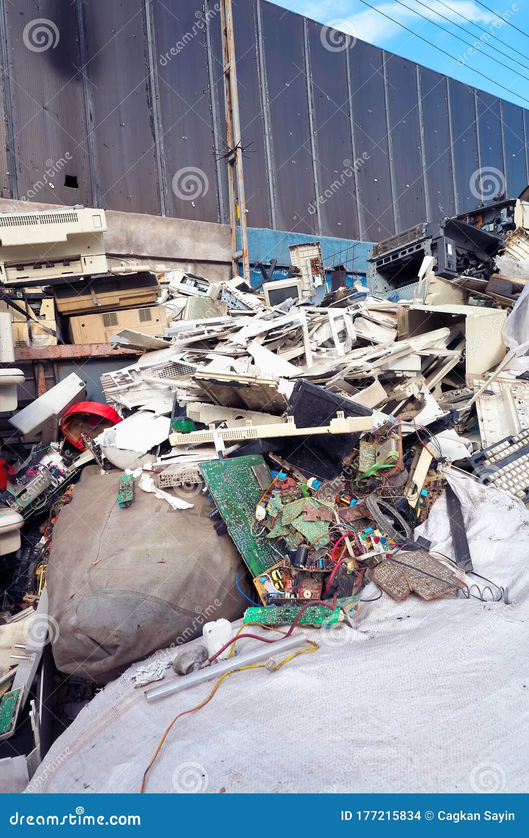 stack of dismantled computer parts for recycling in a junkyard