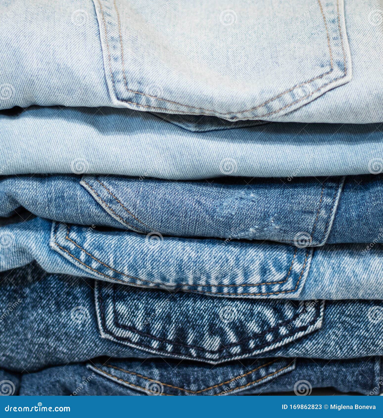 A Pile of Folded Jeans in Blue Background of Clothing in Indigo Blue ...