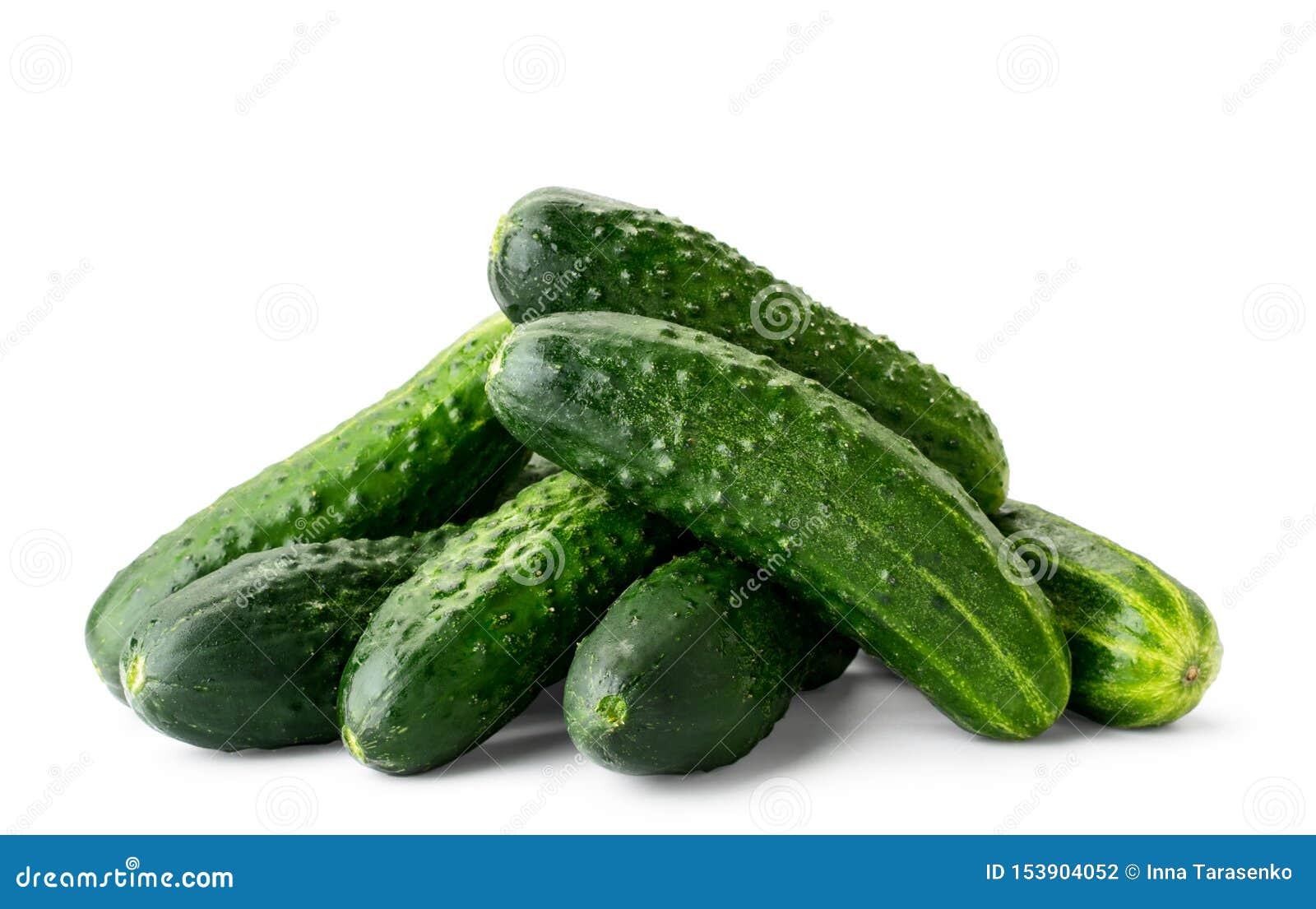 pile of fresh ripe cucumbers close-up on a white background. 