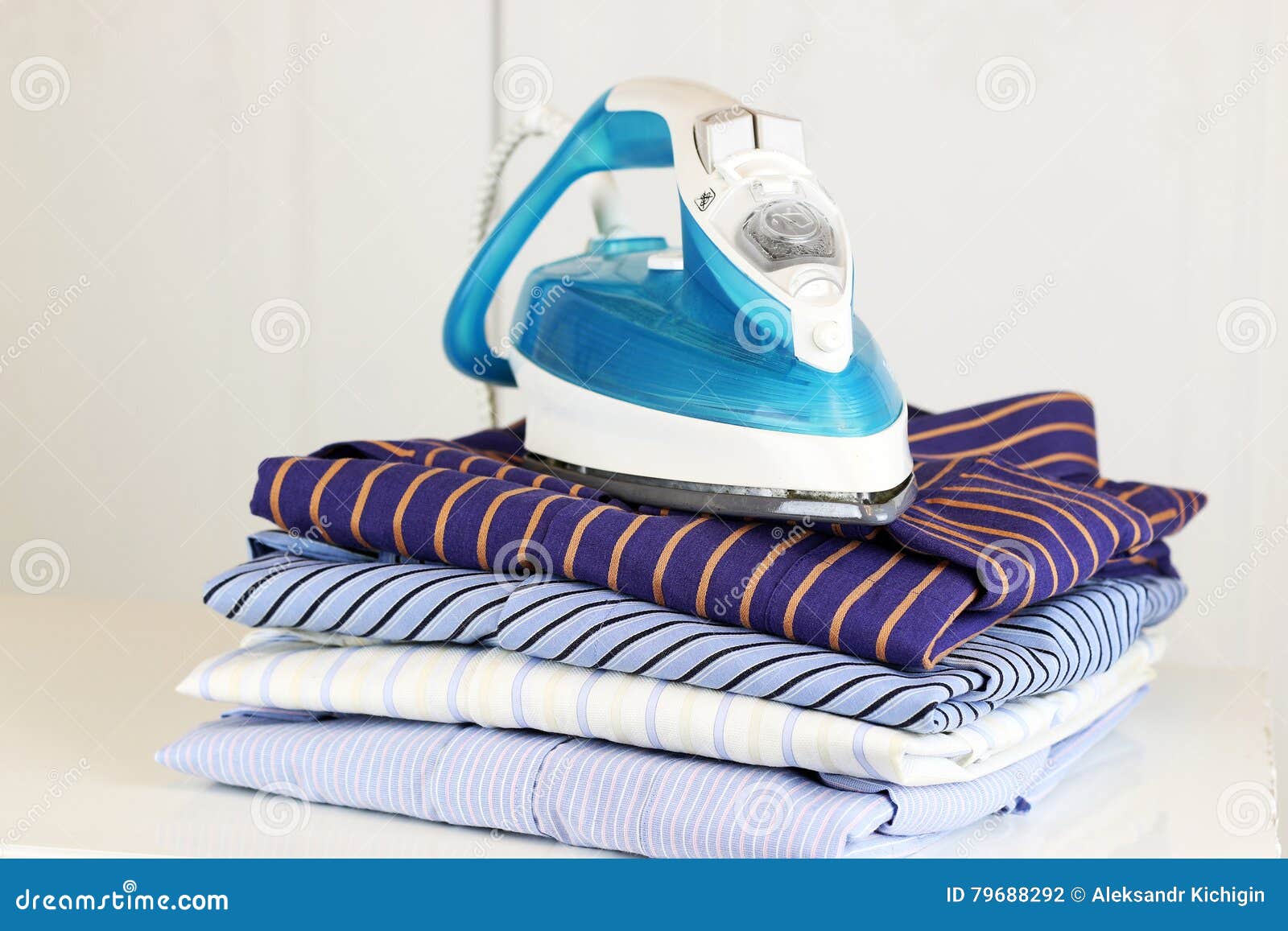 Pile of Ironing Shirts and Hand Stock Photo Image of gray, hand 79688292