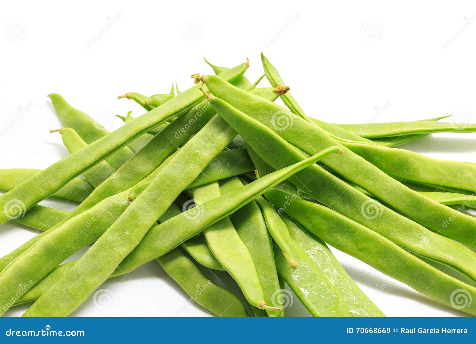 pile of italian flat green beans on a white background