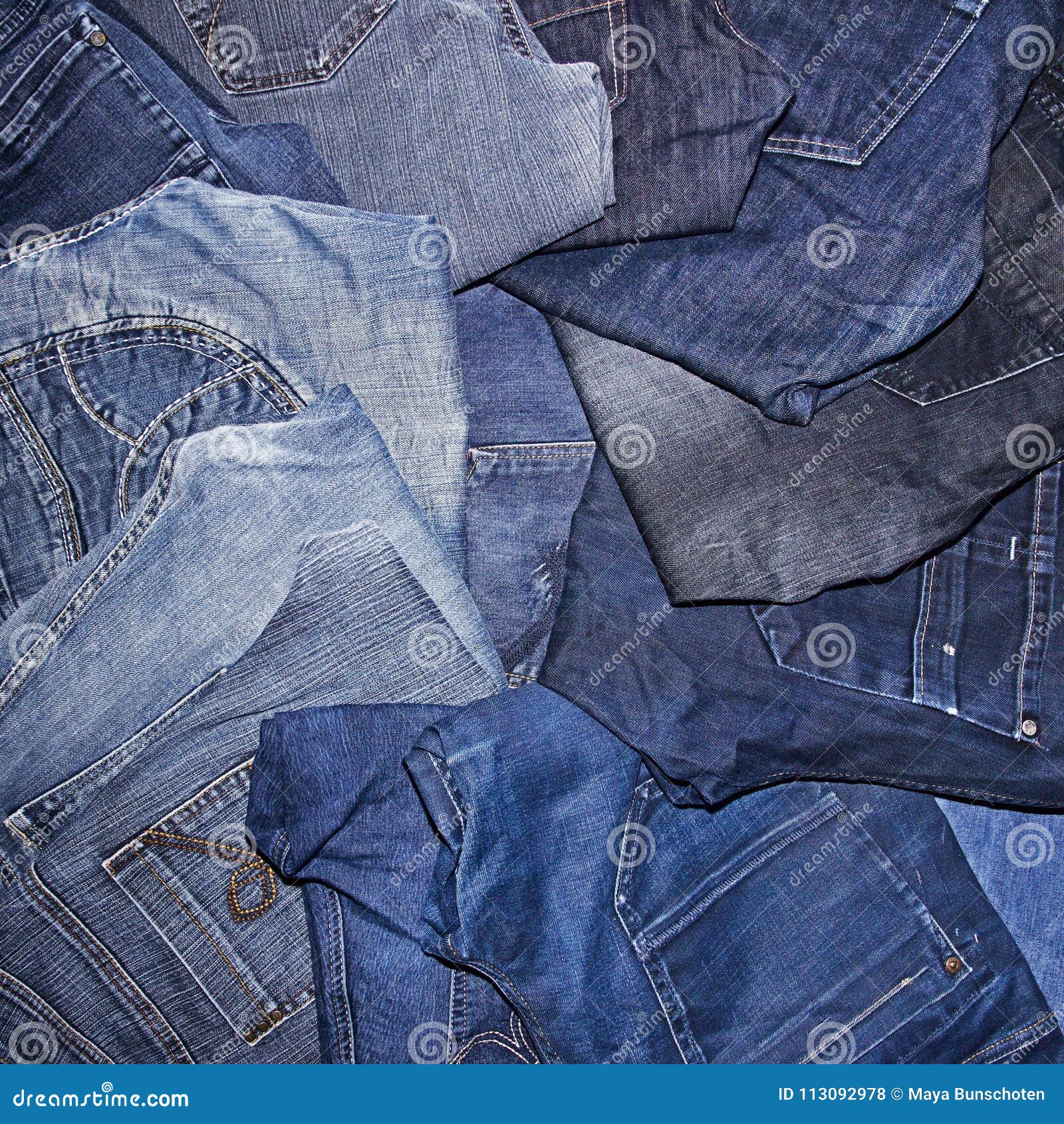 Pile of jeans stock photo. Image of apparel, attire - 113092978