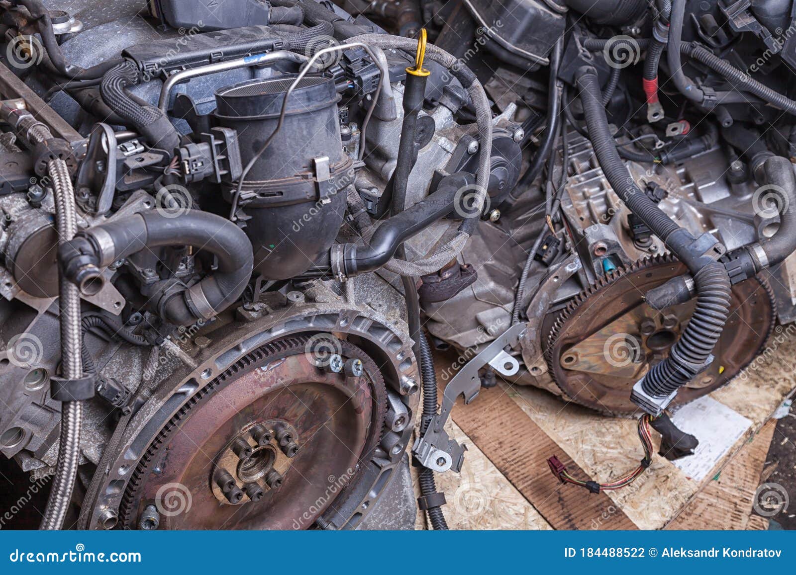 a pile of metal assemblies - second-hand engines in a garage or car repair shop. background for auto service or men`s magazine