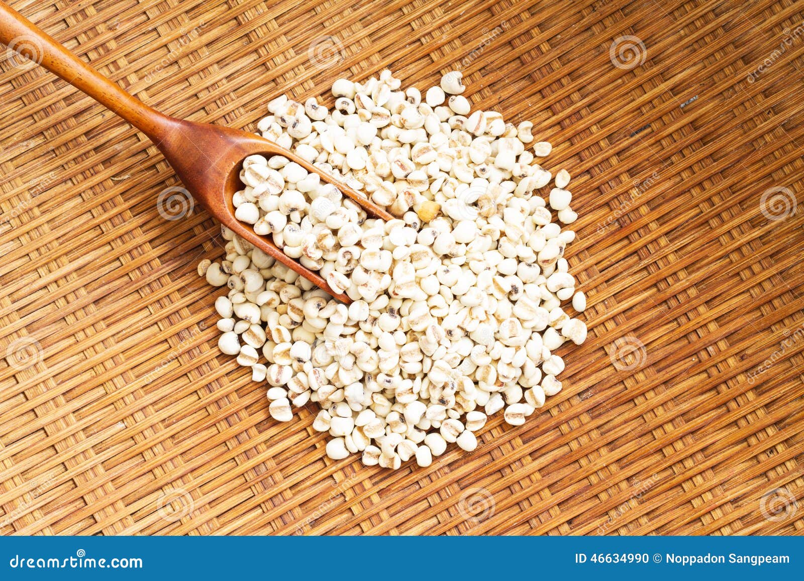 pile of millet (grains) in a wooden basket.