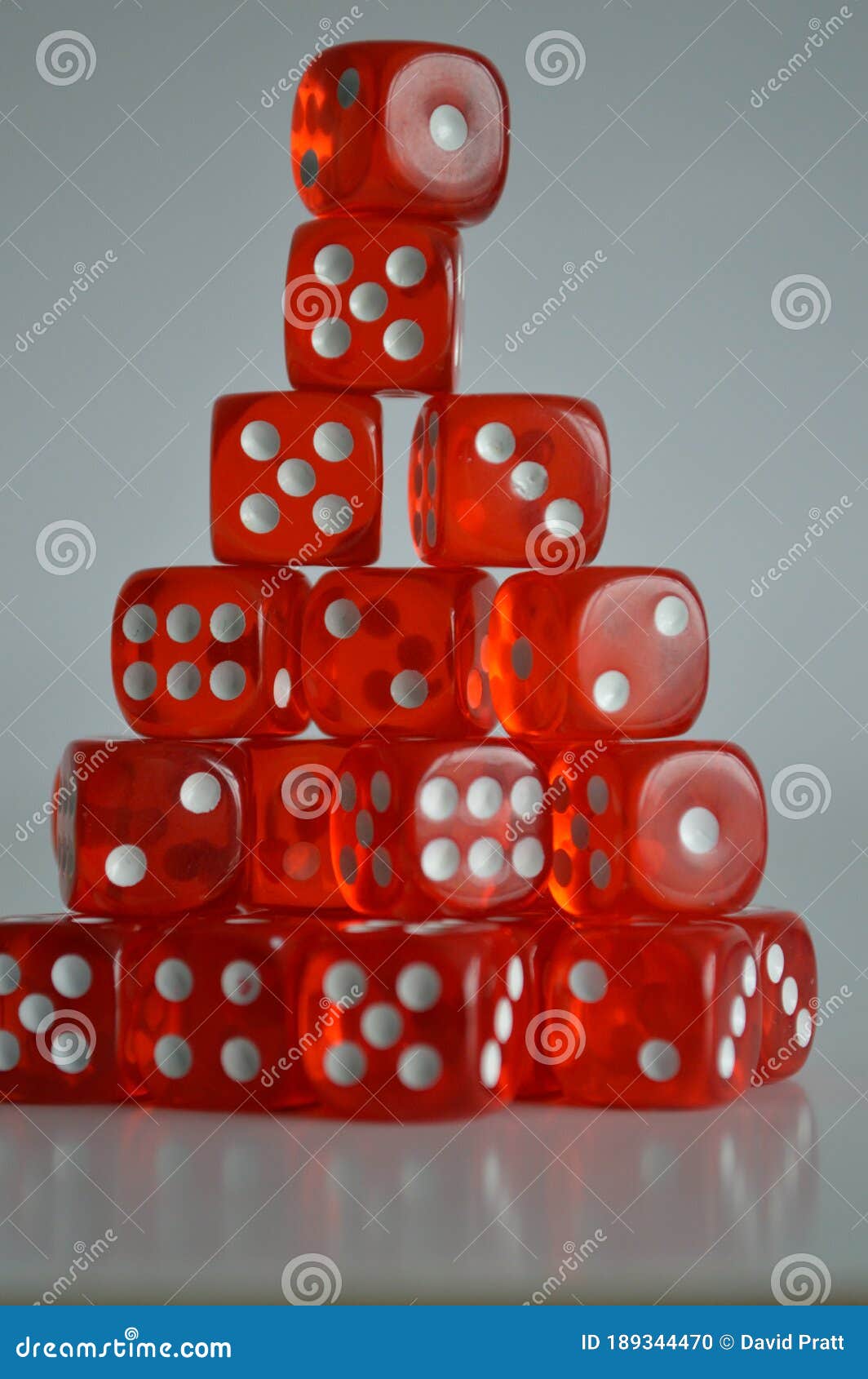 pile of multiple red plastic arcylic d6 six sided die dice variable focus