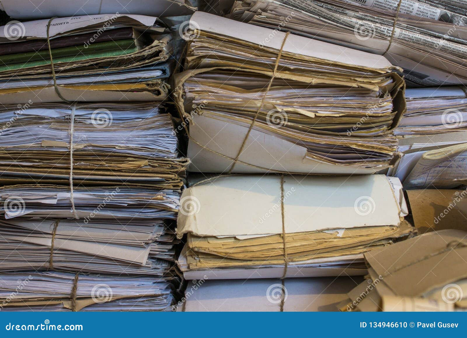 pile of old papers and newspapers in the archive