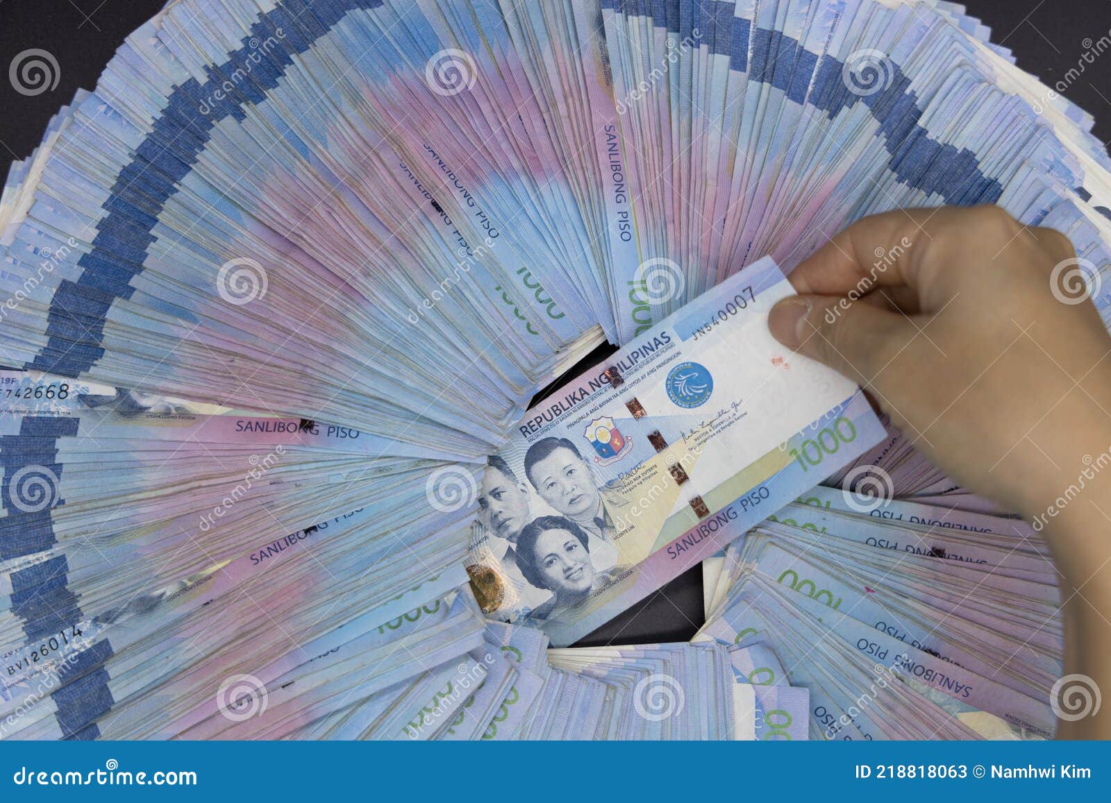 A pile of one thousand Philippines banknotes. Cash of Thousand