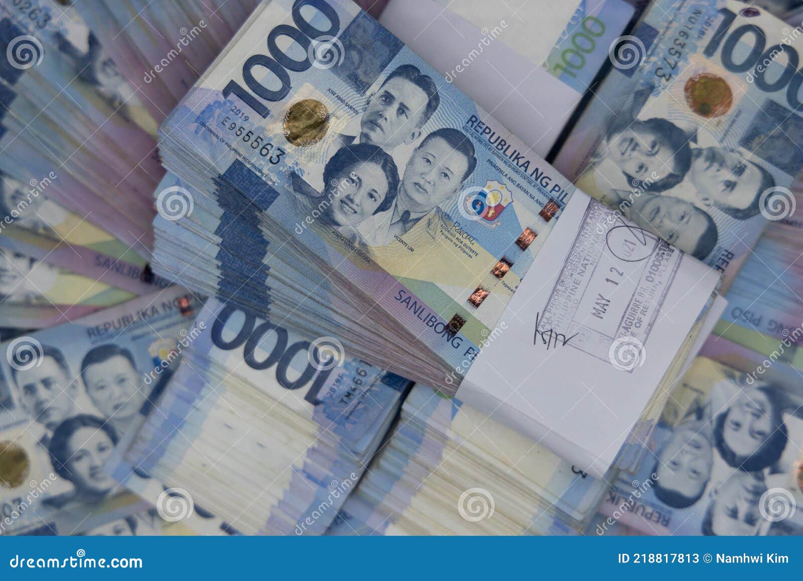 A pile of one thousand Philippines banknotes. Cash of Thousand