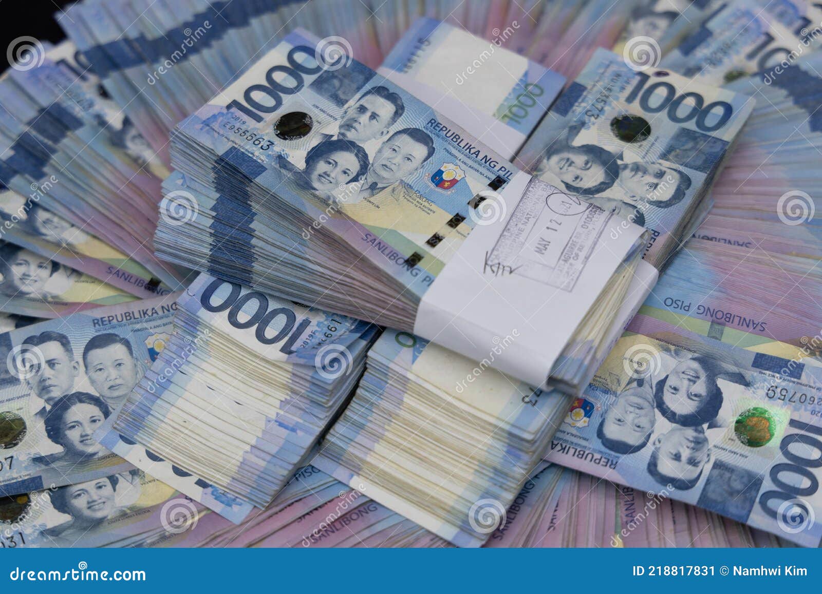 A Pile of One Thousand Philippines Peso Banknotes. Cash of