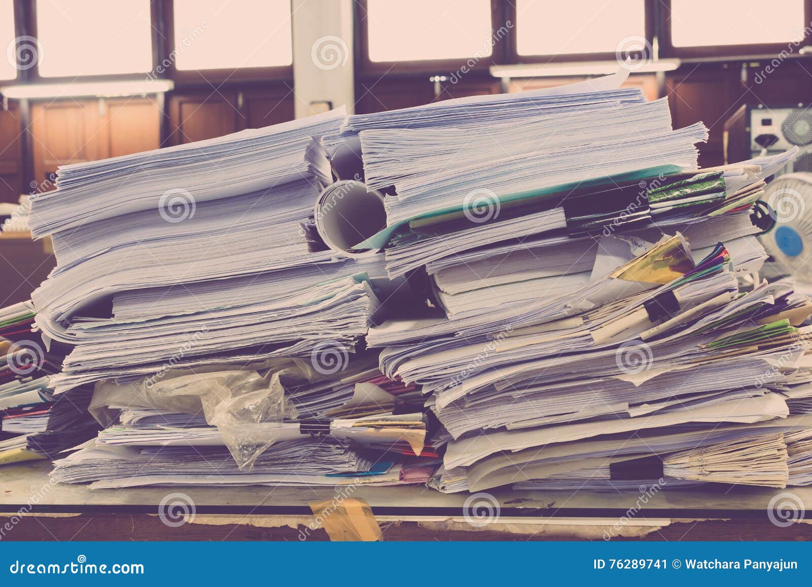 pile of papers laid overlap on the desk