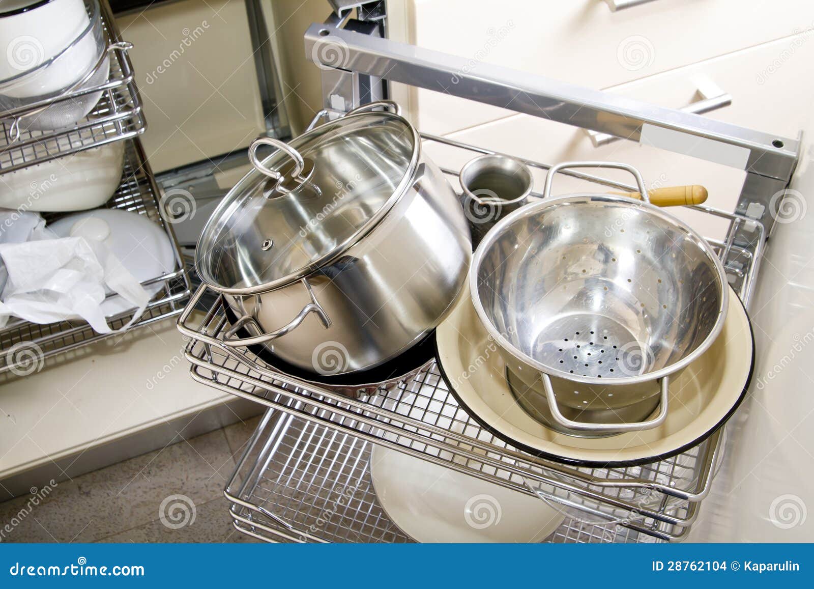Pile of Pots and Pans in the Cupboard Stock Photo Image of white