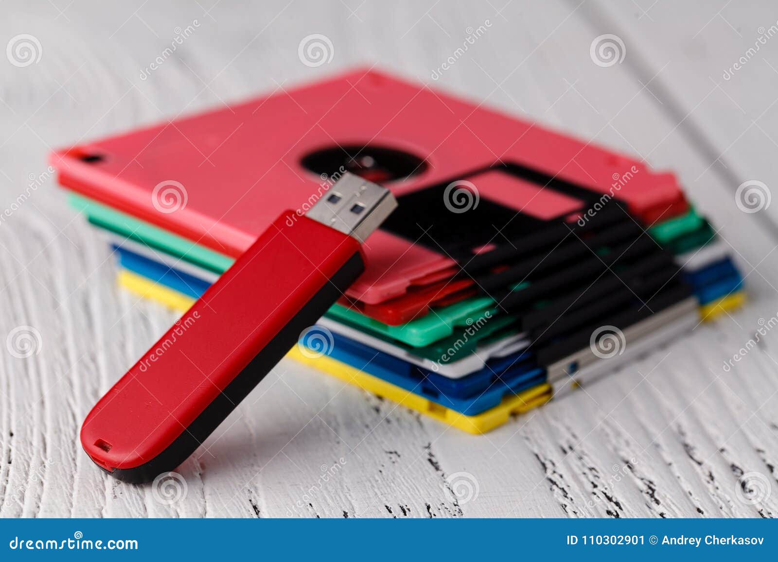 Pile of Retro Floppy Disk Versus Usb Flash Driver Stock Image