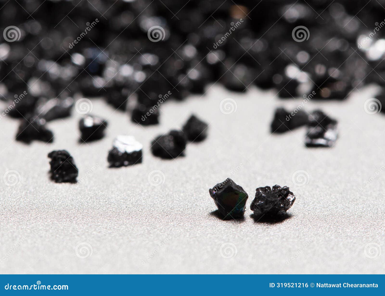 pile of silicon carbide. black silicon carbide crash in small pieces as material based. fine particle circle around, white