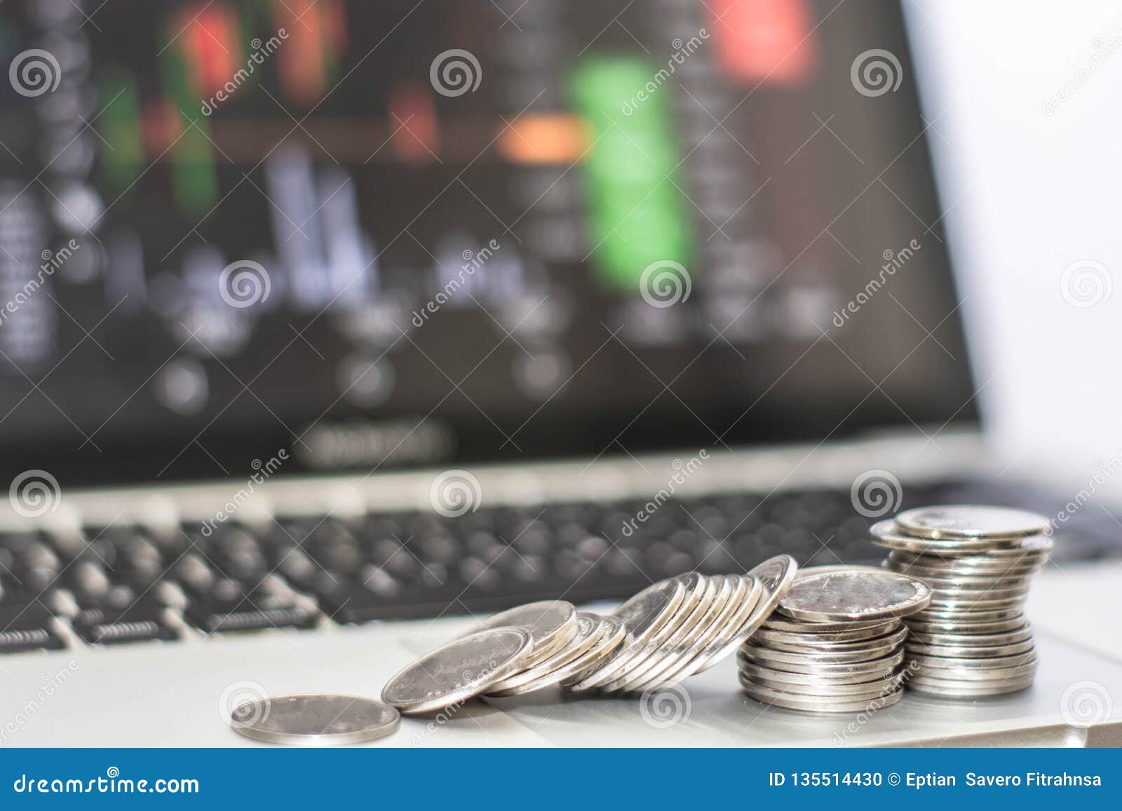 pile of silver coin colapse with monitor shows trading traffic, bitcoin minning