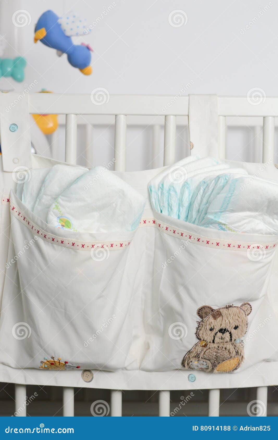 Pile or Stack of Diapers in Baby Bed Hanging Storage Bag Stock Photo
