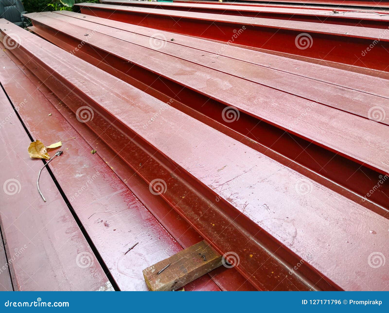 Pile of Steel Beam Paint Red Color Preparing for Structure Construction