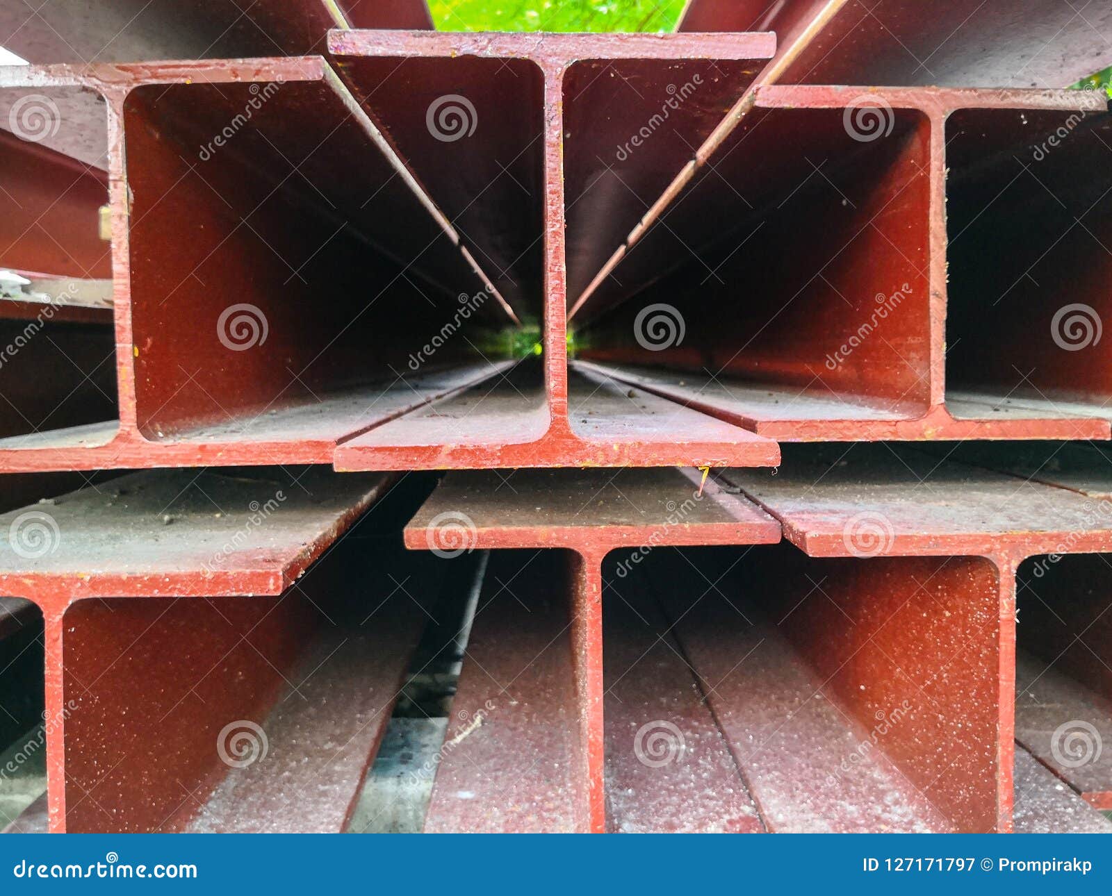 Pile of Steel Beam Paint Red Color Preparing for Structure Construction