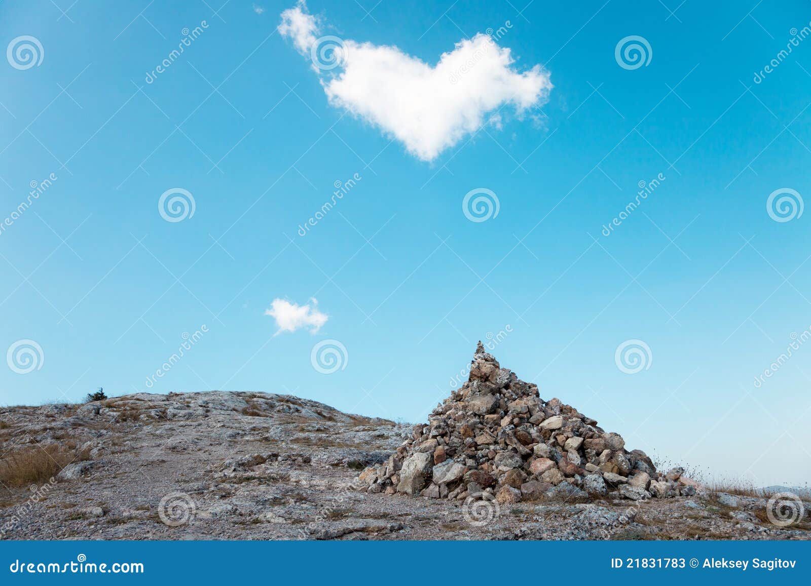 A Pile of Stones and Cloud in the Shape of Heart Stock Image - Image of ...