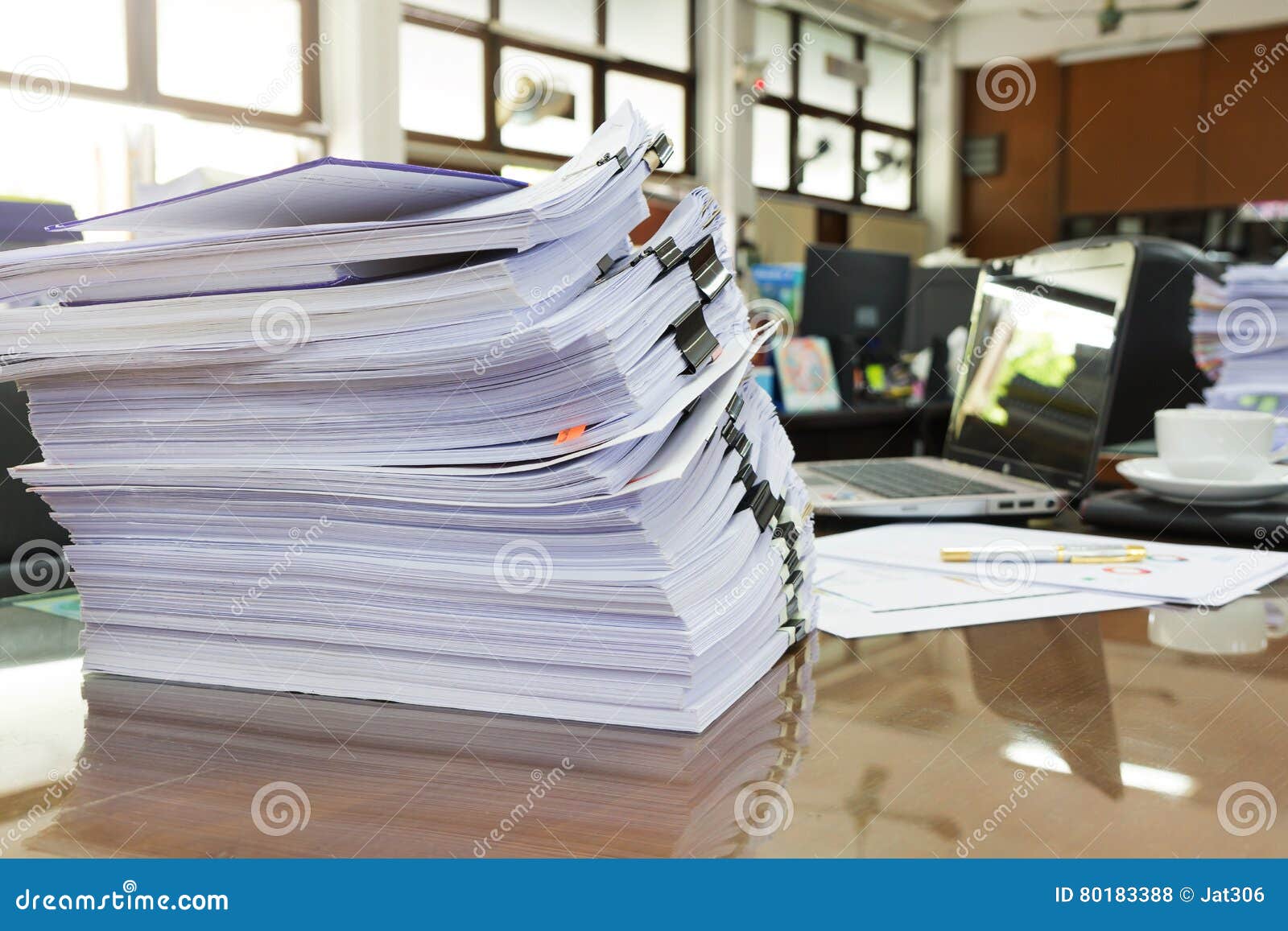 Pile of Unfinished Business Documents on Office Desk, Stack of Business