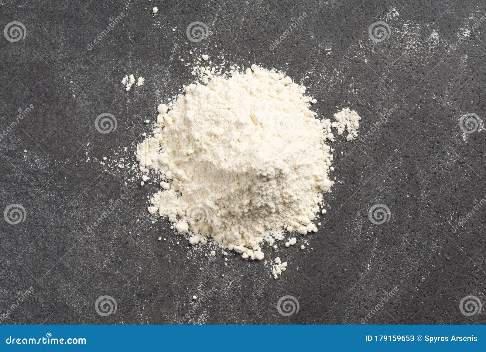 Pile of Wheat Flour on a Messy Granite Kitchen Counter Stock Image