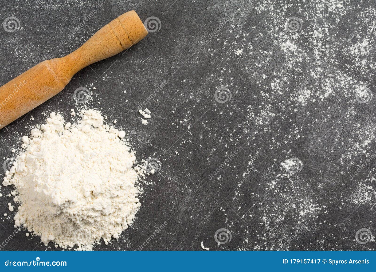 Pile of Wheat Flour and a Rolling Pin on a Messy Granite Kitchen