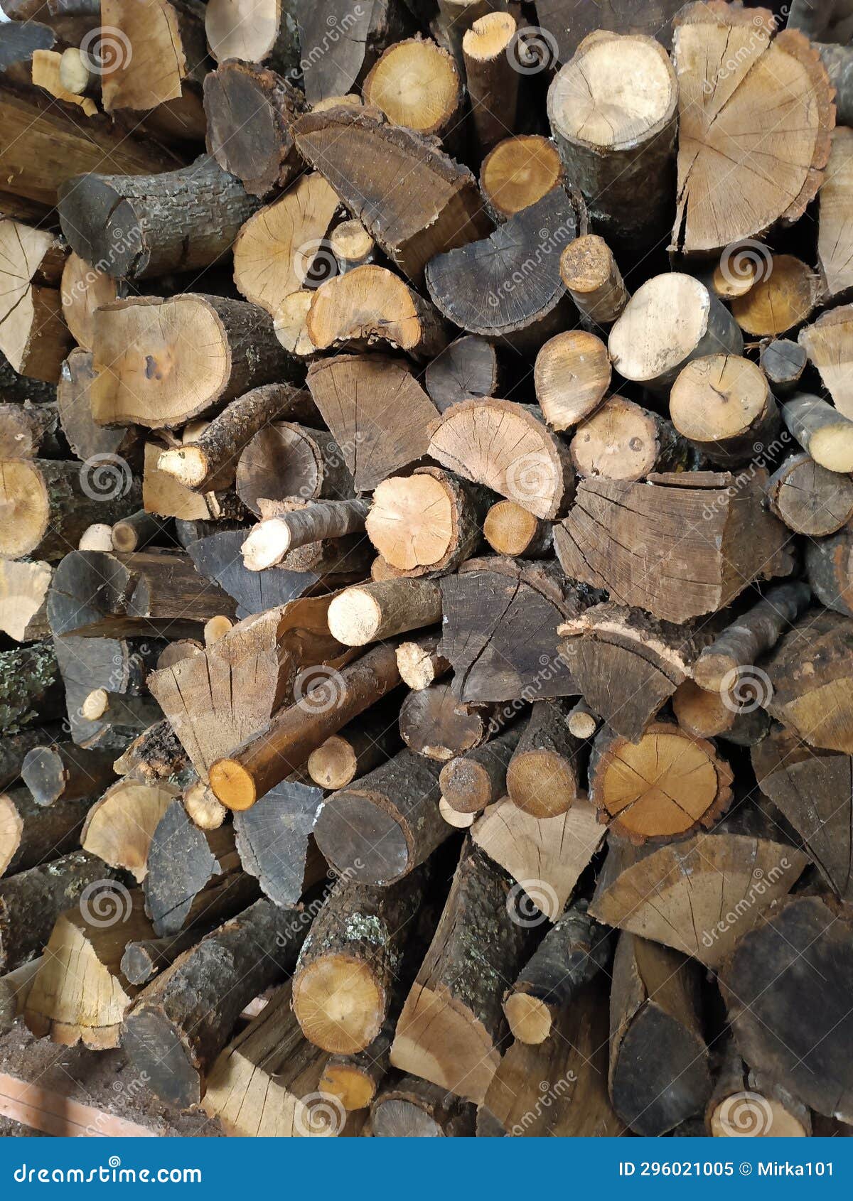 pile of wood logs.  warm background