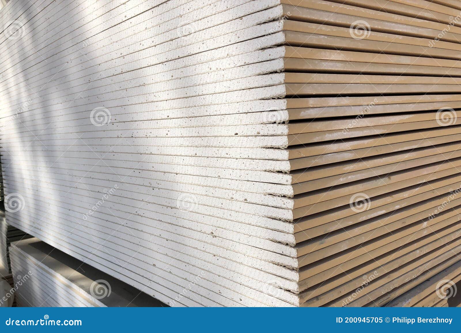 Piled Sheets of Drywall. Stacked Plasterboard Sheets. Gypsum Cardboard
