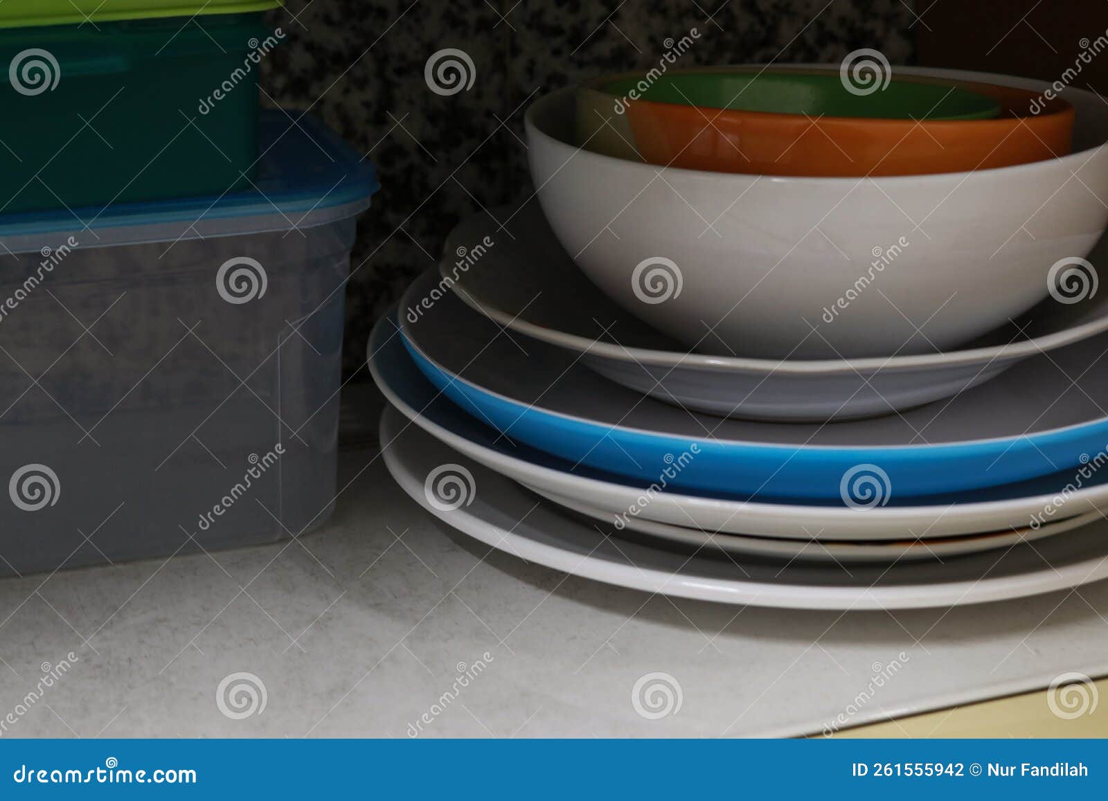 Piles Of Plates, Crockery And Ceramics On Shelves In Charity Shop
