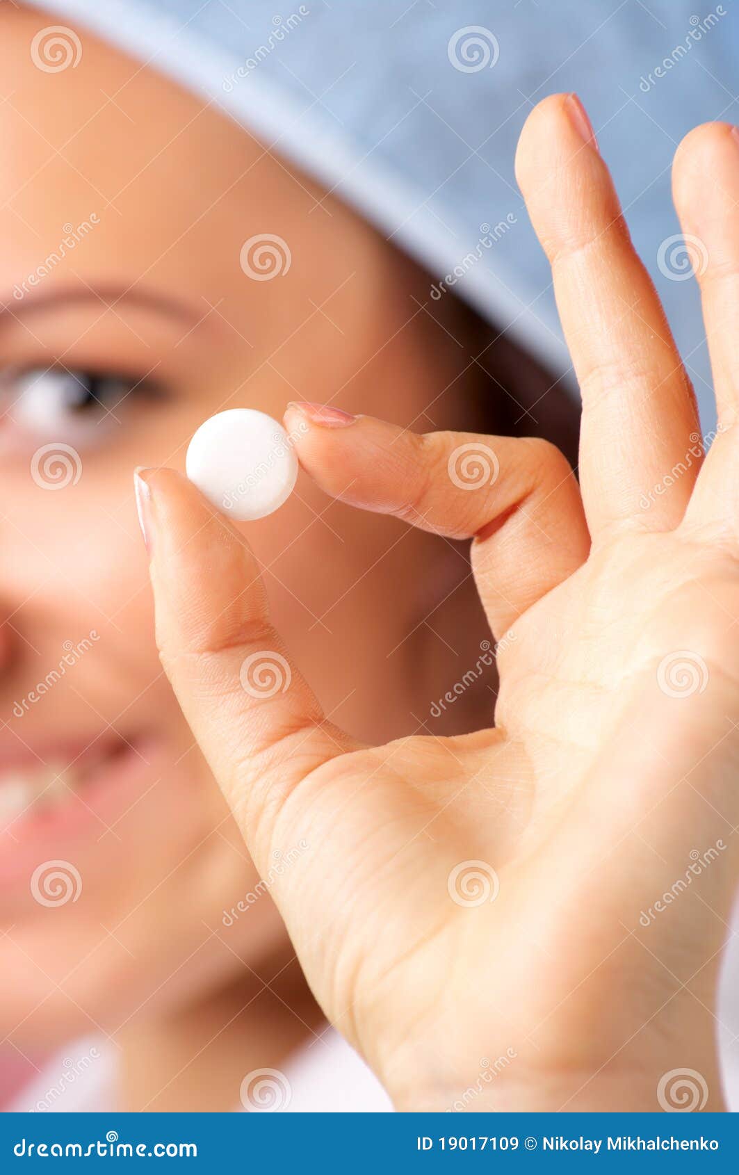 Closeup view of medical pill in the woman hand