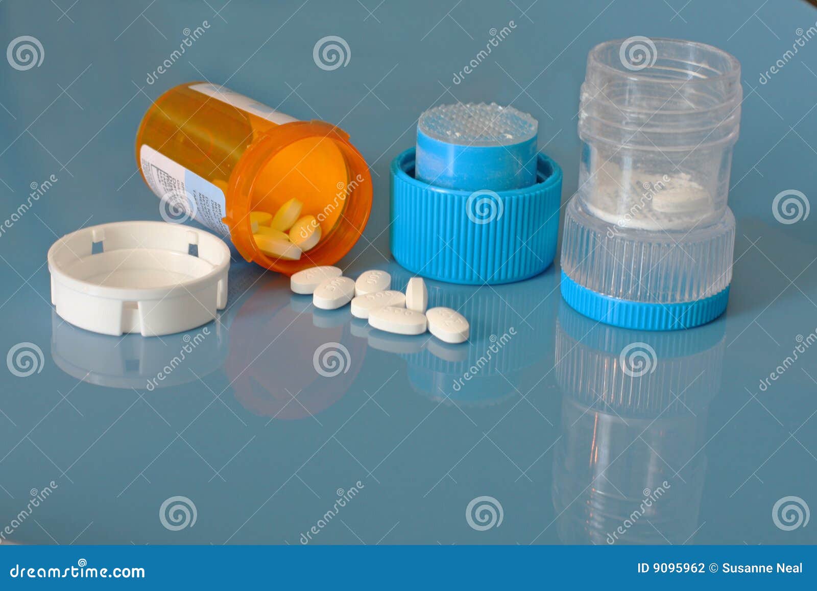 pill crusher and prescription bottle with pills
