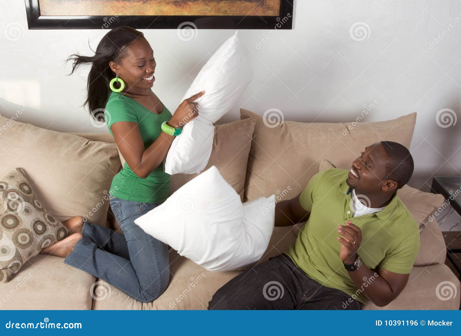 Pillow Fighting between Young Black Ethnic Couple Stock Photo Image