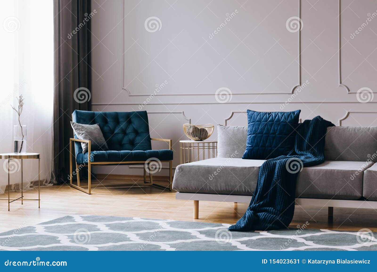 Pillows And Blanket On Modern Sofa In Bright Living Room 